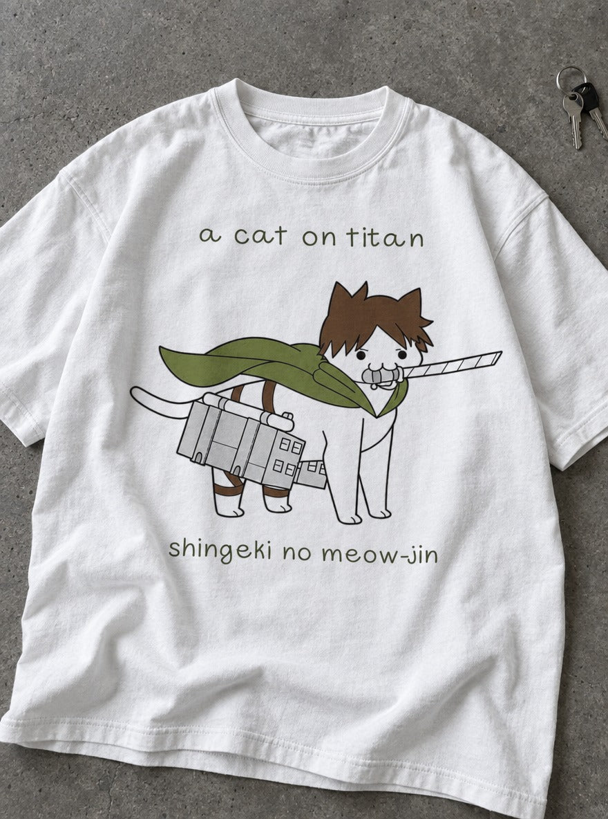 A Cat on Titan – White Tee – flat-lay | Meme Tees