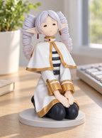 Frieren Kneeling Figure – on a desk | Frieren