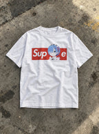 Supreme – White Tee – flat-lay | Meme Tees